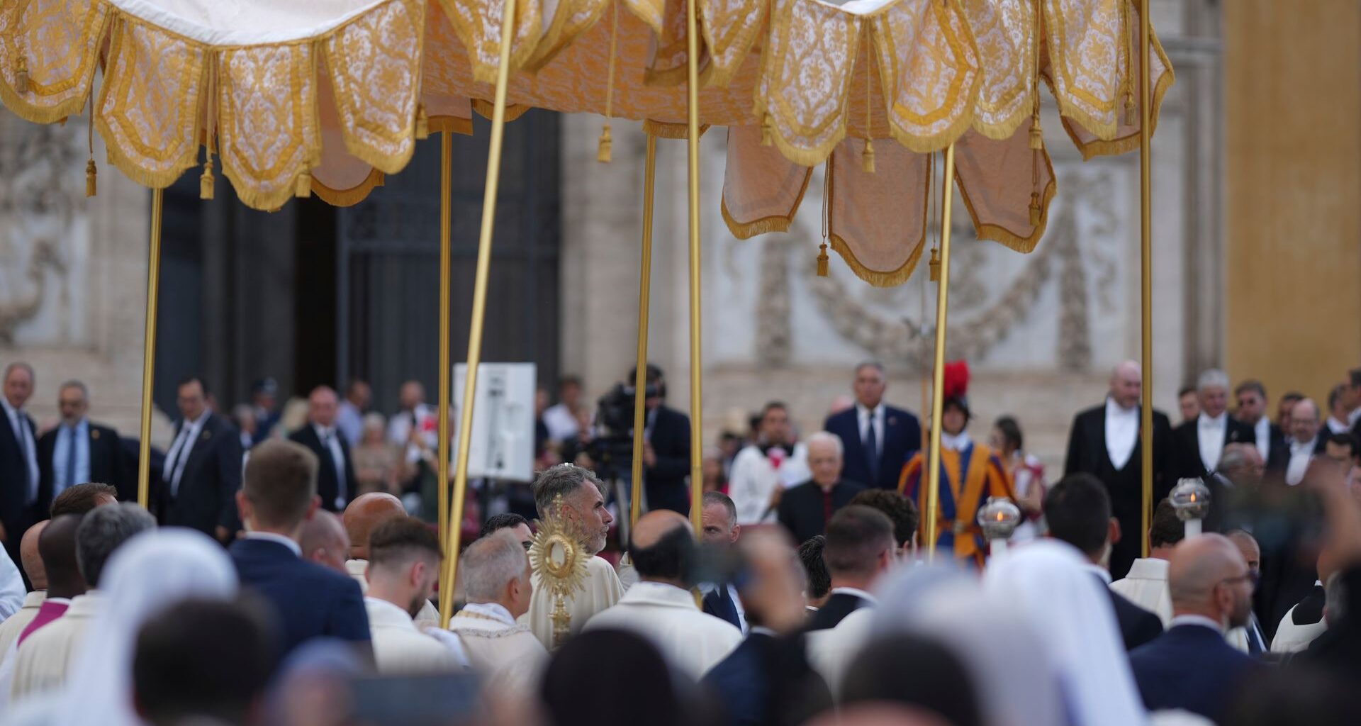 Thousands of faithful lined the streets of Rome for the feast of Corpus Christi, as Pope Leo carried the monstrance in procession.