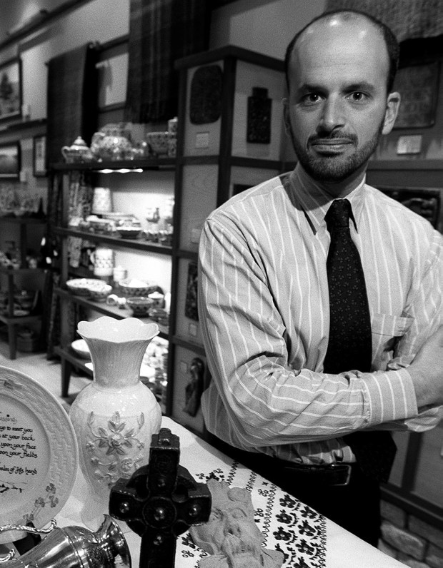 Store owner, Richard Kosmacher, with examples of his merchandise to go with a story on the upsurge in interest of all things Celtic. Items from the Joy of Ireland store on North Michigan Avenue in Chicago, 1998. (Bill Hogan/Chicago Tribune)