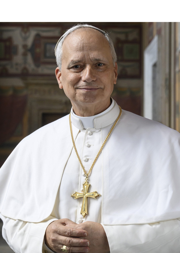 Pope Leo XIV smiles in a newly released photograph, wearing the traditional white cassock and gold pectoral cross first seen during his May 8 election greeting at St. Peter’s Basilica (Holy See Press Office).
