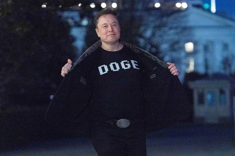 Elon Musk wearinga DOGE t-shirt