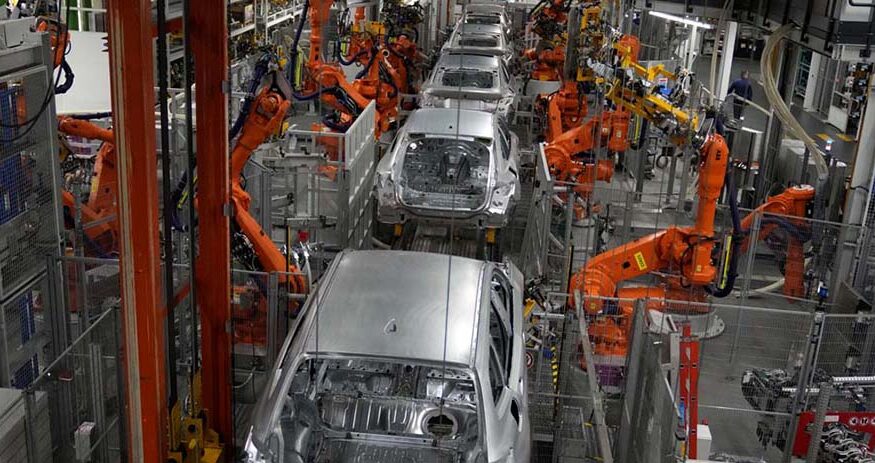 Robots work on a BMW assembly line in Munich, Germany