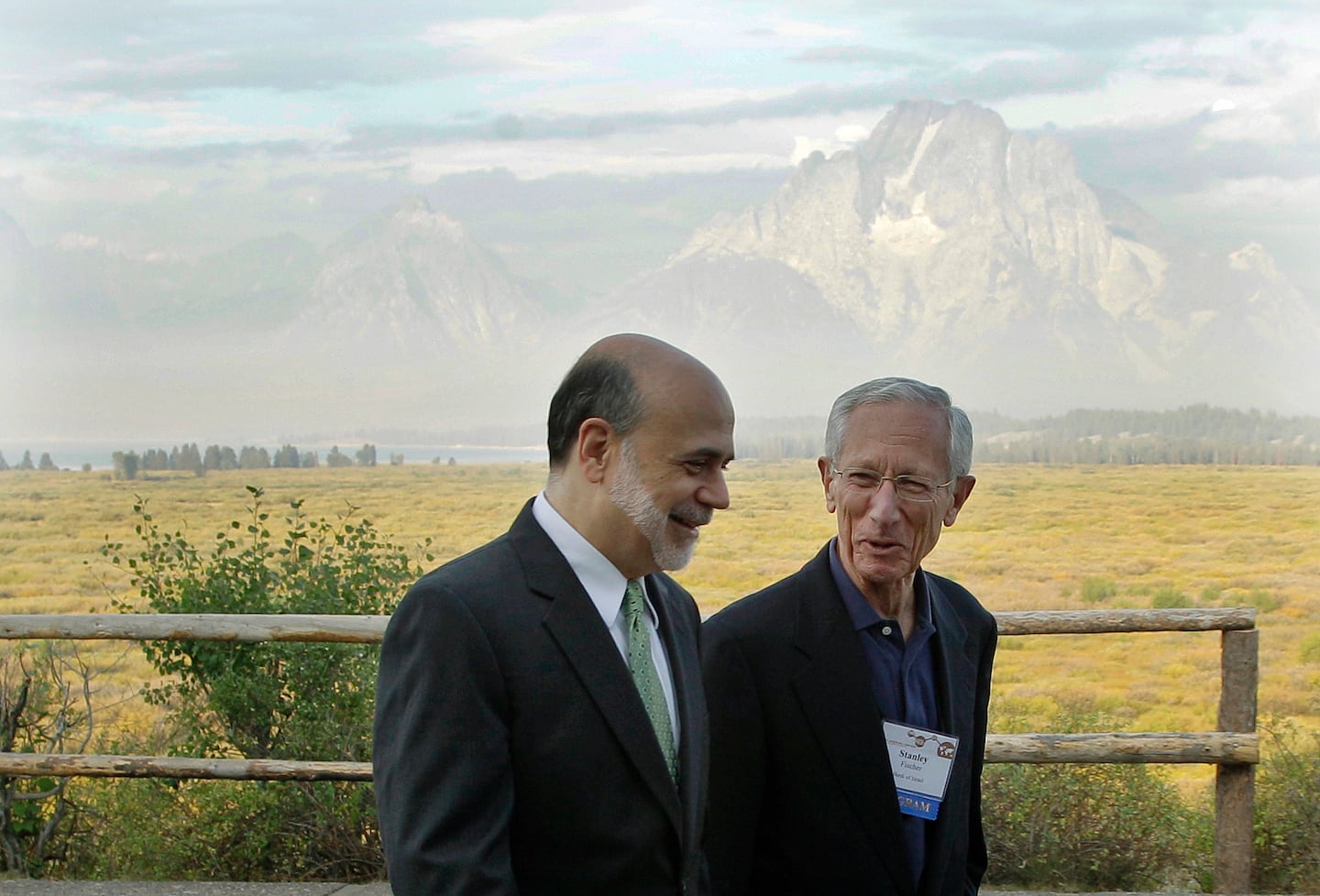 With the Teton Mountains behind them, Ben Bernanke, then Federal Reserve chairman, chatted with Dr. Fischer outside of the Jackson Hole Economic Symposium in 2012.