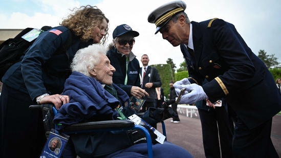 Former U.S. Army nurse Betty Huffman-Rosevear engaged warmly with attendees ahead of a memorial ceremony commemorating the 81st anniversary of the D-Day landings. Held at the American Cemetery in Colleville-sur-Mer on June 6, 2025. (Photo by Lou BENOIST / AFP)(AFP)