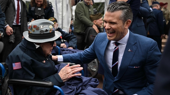 U.S. Secretary of Defense Pete Hegseth shared a heartfelt moment with 102-year-old World War II and D-Day veteran Jake Larson, affectionately known as “Papa Jake,” following a memorial ceremony at the American Cemetery in Colleville-sur-Mer on June 6, 2025. (Photo by Lou BENOIST / AFP)(AFP)