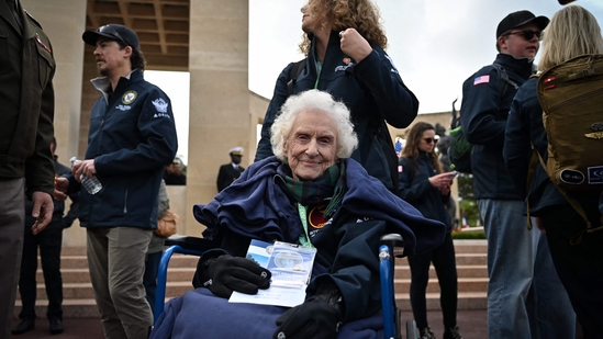 In frame, former U.S. Army nurse Betty Huffman-Rosevear looks on, ahead of a memorial ceremony marking the 81st anniversary of the D-Day landings. Held at the American Cemetery in Colleville-sur-Mer, Normandy, on June 6, 2025. (Photo by Lou BENOIST / AFP)(AFP)