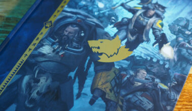 The cover of a Space Wolves Codex on a wooden surface