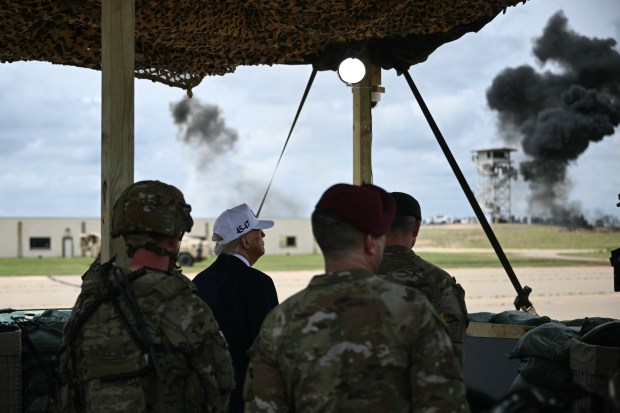 US President Donald Trump watches a military demonstration at Fort Bragg, a US Army military installation, near Fayetteville, North Carolina, on June 10, 2025. (Photo by BRENDAN SMIALOWSKI/AFP via Getty Images)