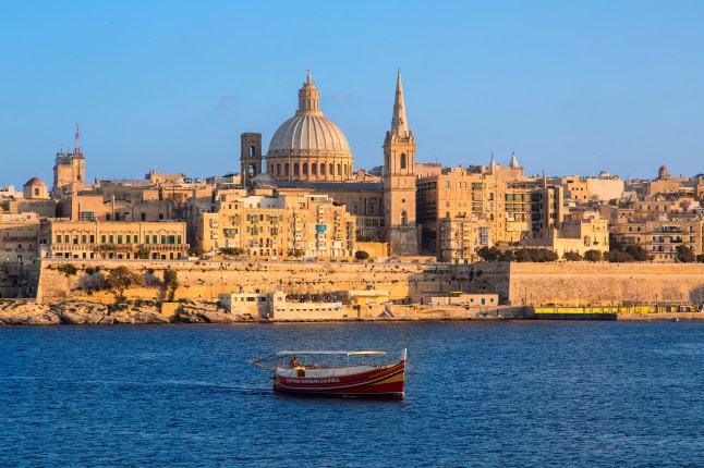 A view of Valletta in Malta at sunset, captured from the water