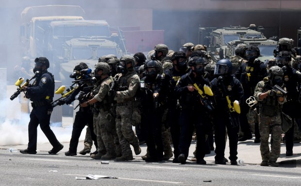 National Guard troops have begun arriving in Los Angeles on orders from President Donald Trump to stamp out protests that have broken out in recent days against federal immigration authorities seeking to carry out deportations in the region. The members of California's National Guard were seen staging early Sunday at the federal complex in downtown Los Angeles that includes the Metropolitan Detention Center, where confrontations occurred the last two days on Sunday, June 8, 2025. (Photo by Axel Koester, Contributing Photographer)