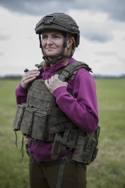 Anna Rybolowicz, 40, wearing a helmet and bullet-proof vest. 