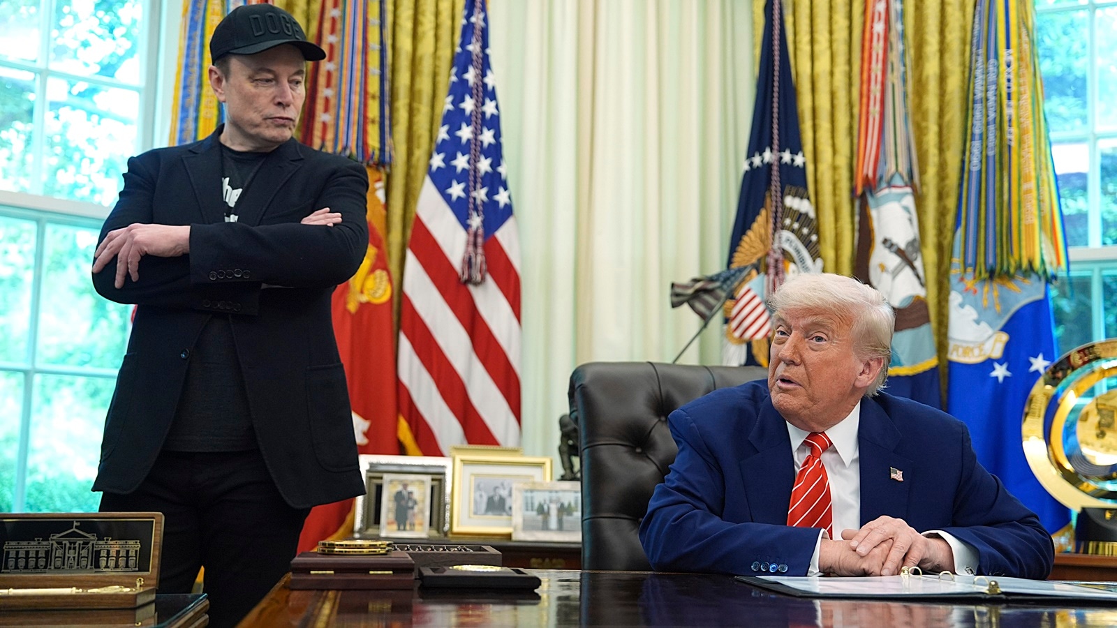 President Donald Trump speaks during a news conference with Elon Musk in the Oval Office of the White House.