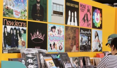 Visitors browse K-pop album covers at the 2025 MyK FESTA held at the Olympic Park Handball Gymnasium in Seoul’s Songpa District on June 19.