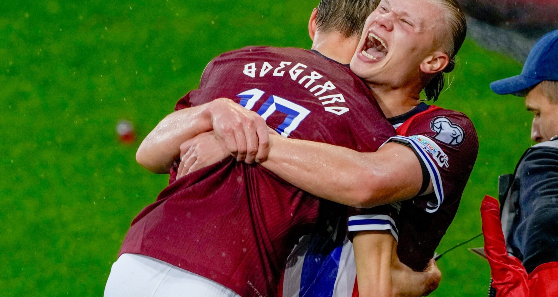 Erling Haaland celebrates with Martin Odegaard during their match against Italy.