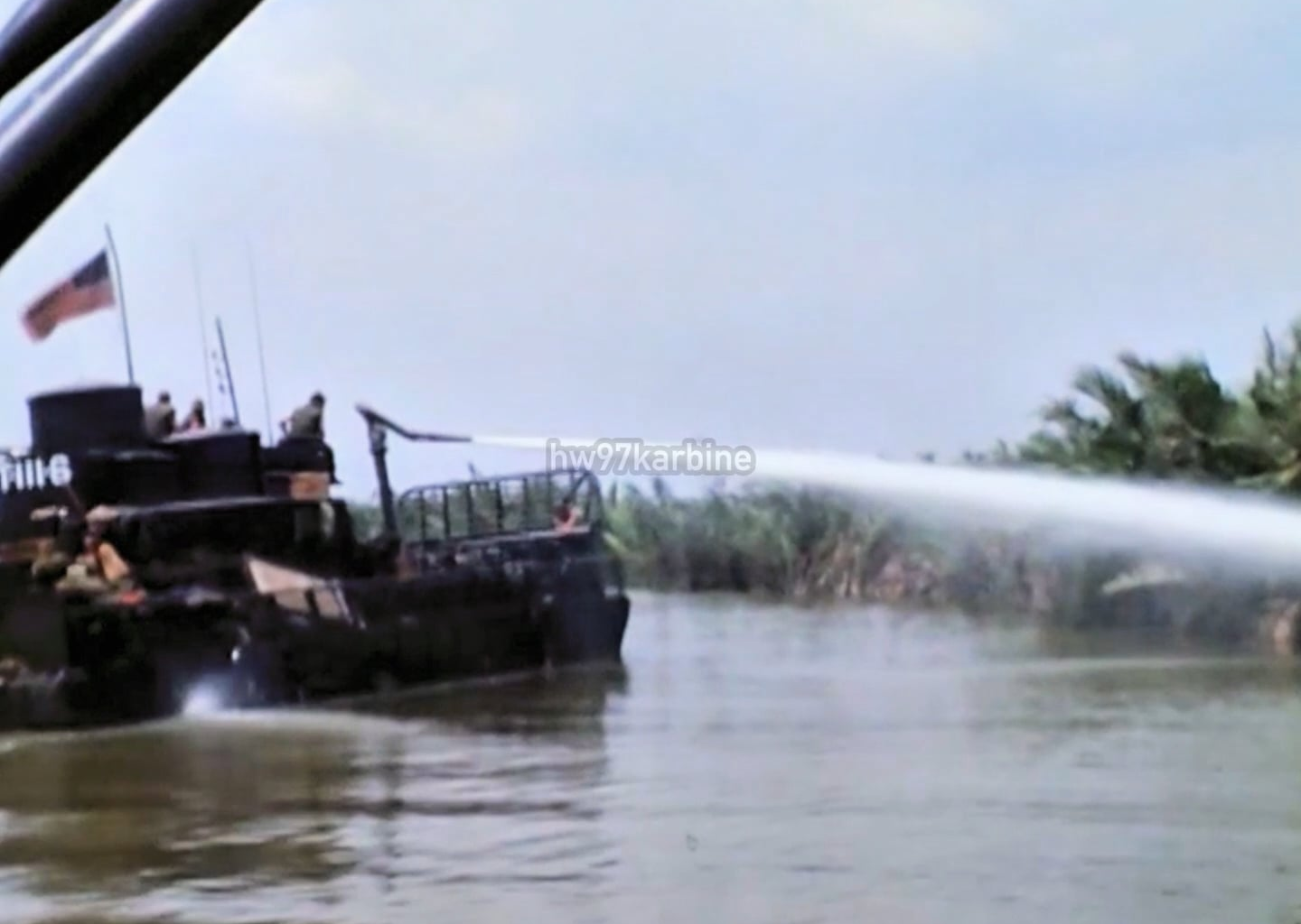 US Brown Water Navy "Douche Boat" experimentally fitted with high pressure water cannon to wash out Viet Cong bunkers and caches along the waterways of the Mekong Delta in 1969