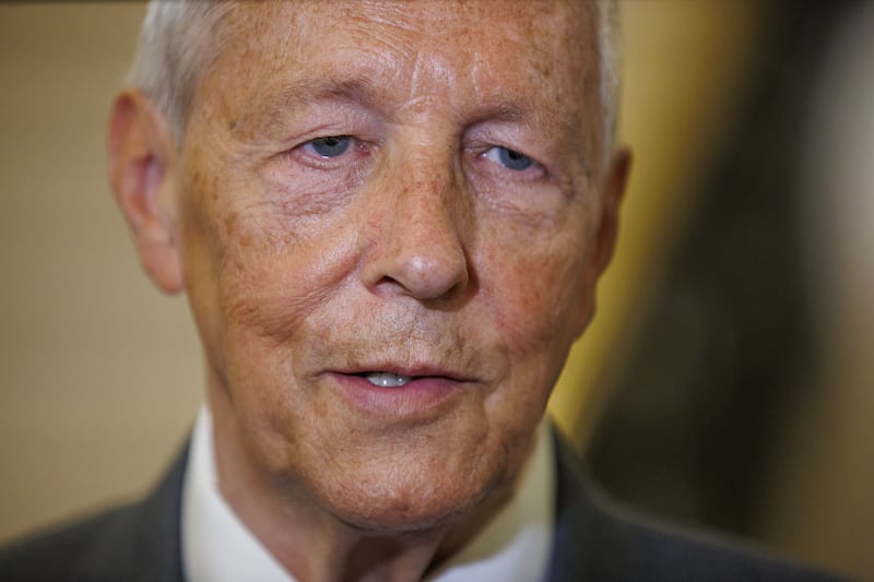 Peter Robinson speaks to the media at Stormont