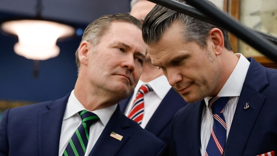 Former National Security Advisor Mike Waltz speaks with Defense Secretary Pete Hegseth (AFP)