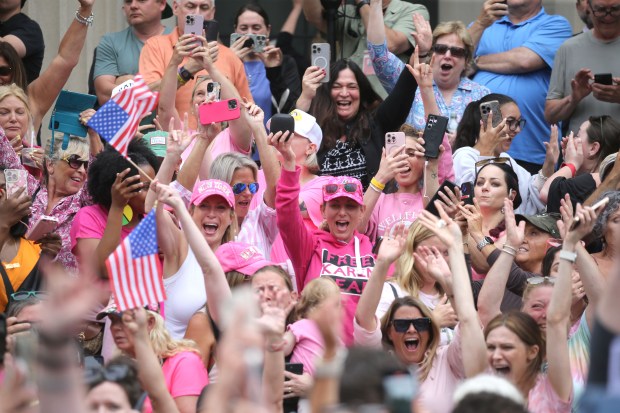 Supporters cheer as the verdicts are read as she is acquitted on many of the charges against her on June 18. (Staff Photo By Stuart Cahill/Boston Herald) 