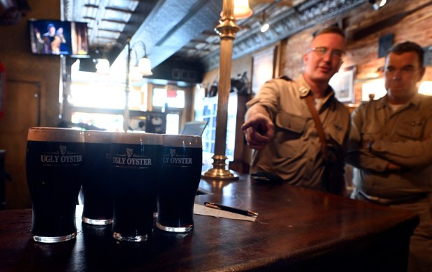 British and American reenactors from the World War II Weekend at Reading Regional Airport eye some Guinness at the Ugly Oyster Pub in downtown Reading on Friday, June 6, 2025. (BILL UHRICH/READING EAGLE)