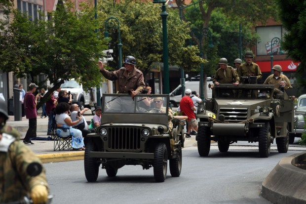 A convoy carrying American, British and German troops from the World War II Weekend at Reading Regional Airport arrives in downtown Reading on Friday, June 6, 2025. (BILL UHRICH/READING EAGLE)