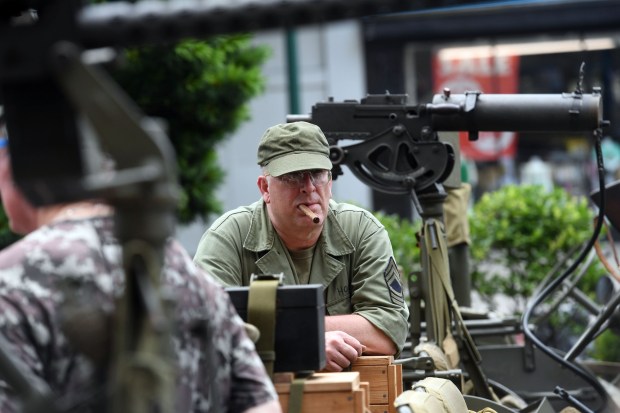 Brian Halm of Big Flats, N.Y., portraying Sgt. Hooch, enjoys a smoke in downtown Reading on Friday, June 6, 2025. (BILL UHRICH/READING EAGLE)