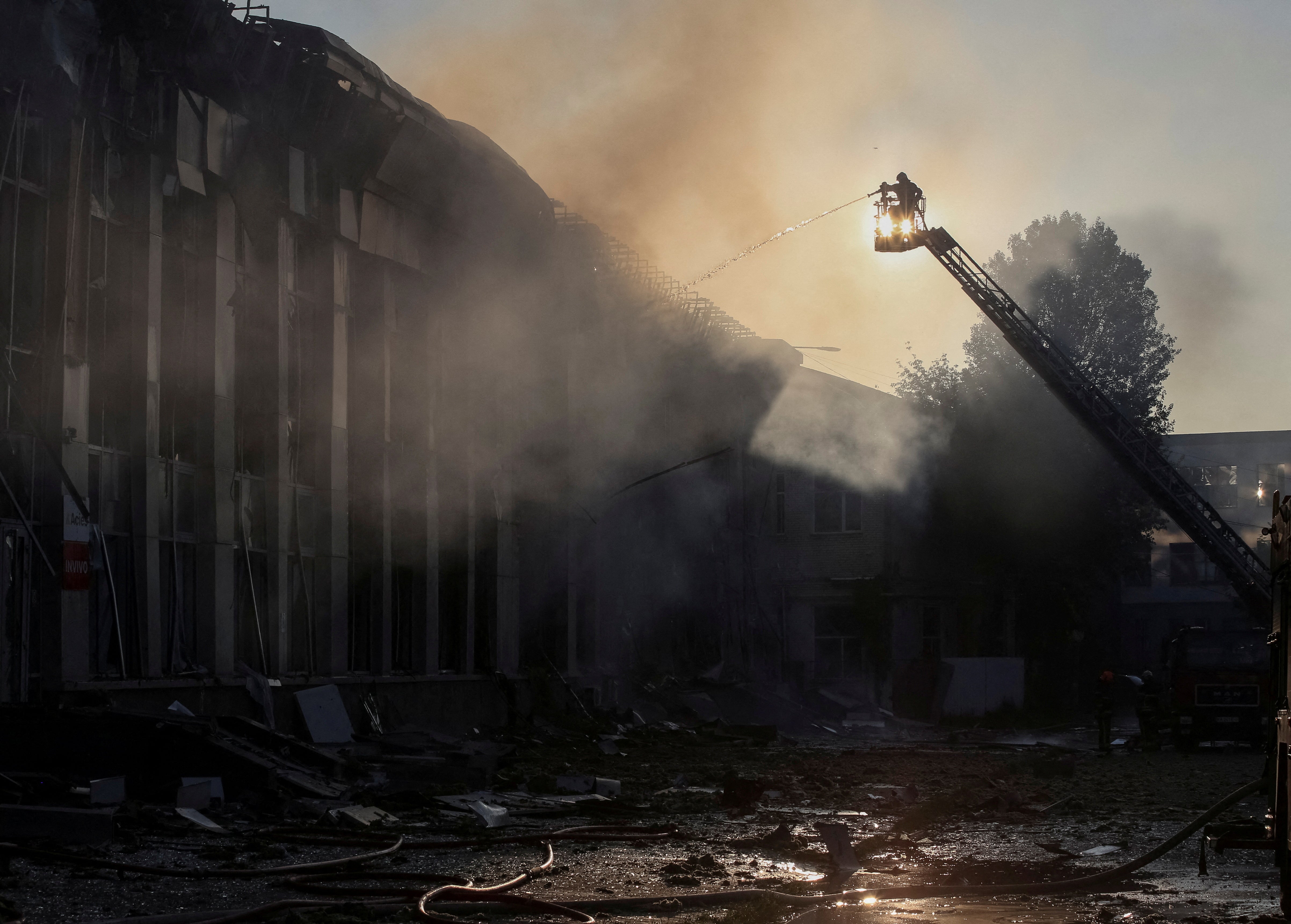 Rescuers work at the site of the Russian drone and missile strike in Kyiv, Ukraine
