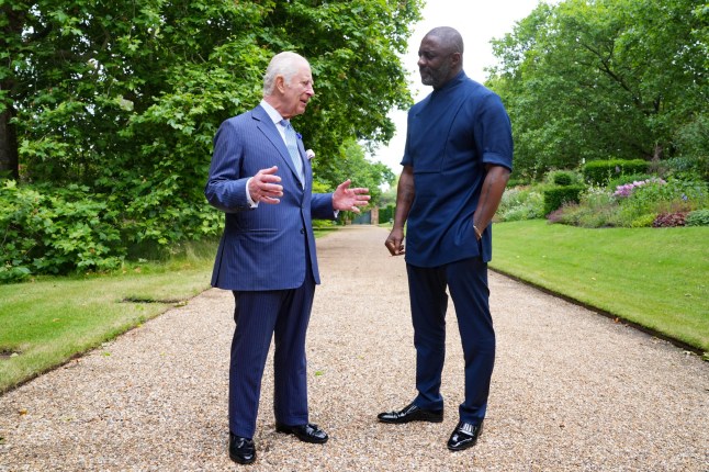 Britain's King Charles III (L) meets British actor Idris Elba during an event for The King's Trust to discuss youth opportunities, at St James's Palace in central London on July 12, 2024. (Photo by Yui Mok / POOL / AFP) (Photo by YUI MOK/POOL/AFP via Getty Images)
