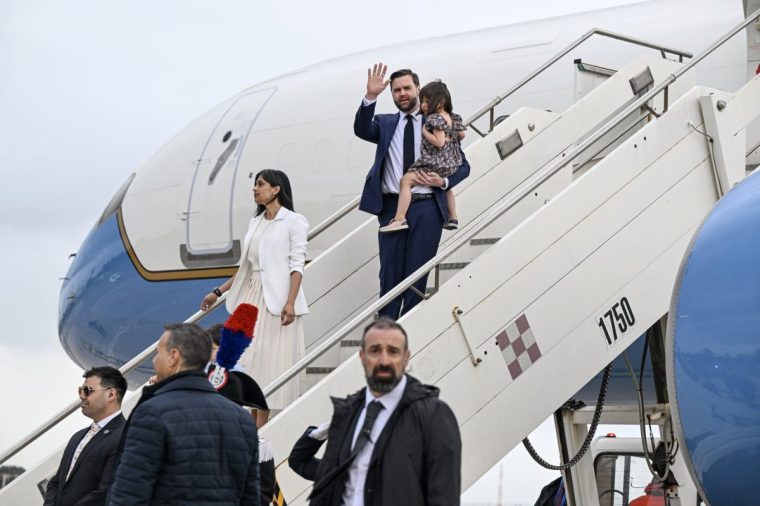 ROME, ITALY - APRIL 18: U.S. Vice President JD Vance carries his daughter Mirabel as he disembarks Air Force Two with Second Lady Usha Vance at G.B. Pastine-Rome Ciampino Airport on April 18, 2025 in Rome, Italy. Vance is traveling to Italy and India through next week. He is scheduled to meet with Italian Prime Minister Giorgia Meloni in Rome before making his first visit to India. (Photo by Kenny Holston - Pool/Getty Images)