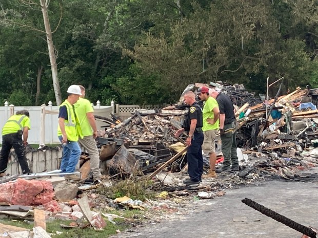 Investigators, including some from state fire marshal's office, at the scene of a house explosion at 14105 S. Kenneth Court in Crestwood on June, 13, 2025. (Mike Nolan/Daily Southtown)