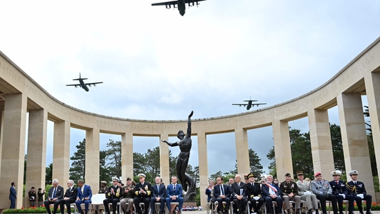 Military aircraft flew in formation over the American Cemetery in Colleville-sur-Mer as U.S. Secretary of Defense Pete Hegseth and French Defence Minister Sébastien Lecornu looked on during a memorial ceremony on June 6, 2025. The flyover was part of the commemorations marking the 81st anniversary of the D-Day landings. (Photo by Lou BENOIST / AFP)(AFP)