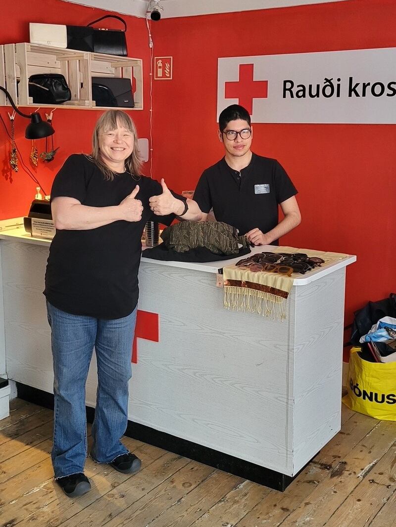 Elder Edwnur Alexander Enrique Ramos Silva assists the shop manager of the Icelandic Red Cross in Reykjavík, Iceland, as part of his service assignment. Elder Ramos Silva is the first ever young service missionary in Iceland, set apart May 12, 2025.