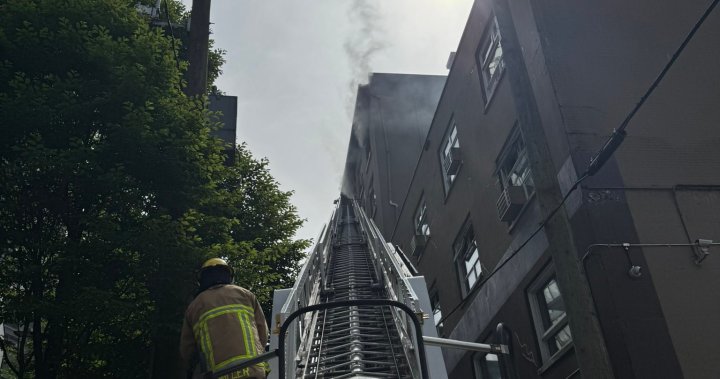 Crews battle 2-alarm fire at former Howard Johnson hotel in Vancouver - BC