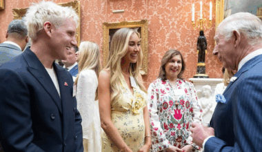 Jamie Laing and Sophie Habboo talking to King Charles at Buckingham Palace