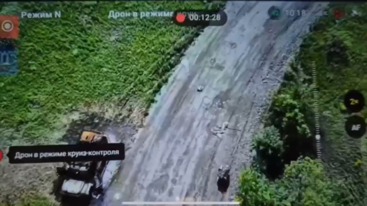 Ukrainian ground drone cut off the fiber optic cable, of a ambush waiting russian FPV, by spinning in place on top of the wire.