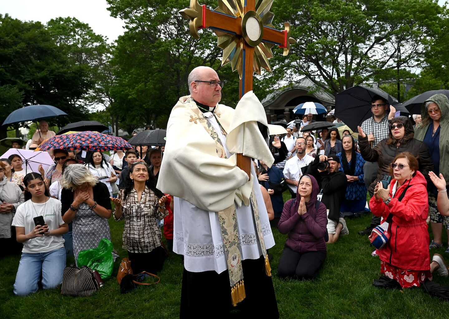 Archbishop Richard G. Henning led a prayer service in Piers Park in East Boston last Sunday as part of a Corpus Christi procession.