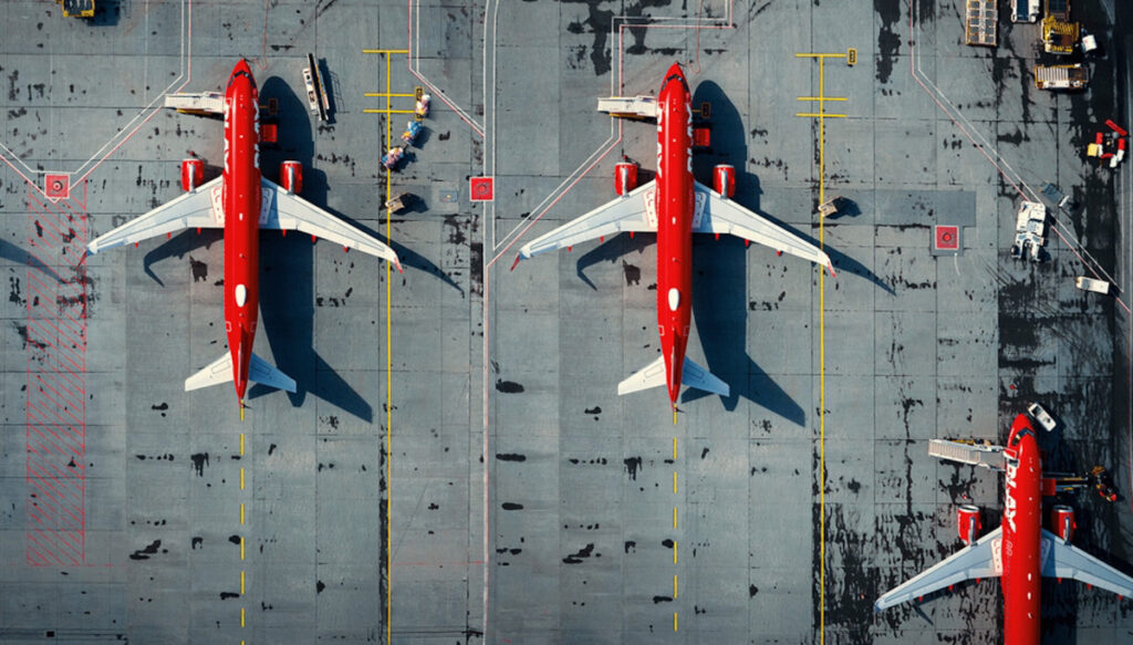 Aerial view of PLAY aircraft parked on the tarmac.