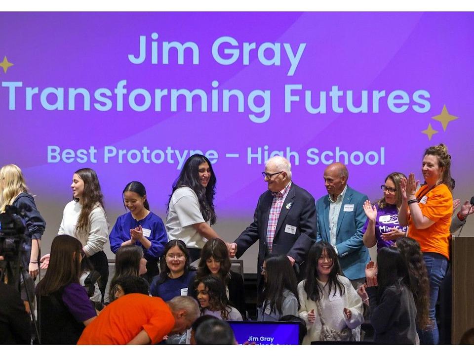  Calgary businessman and philanthropist Jim Gray, centre, shakes hands with the Jim Gray Transforming Futures award-winners for the high school prototype category at the MindFuel Showcase at the U of C on Saturday.