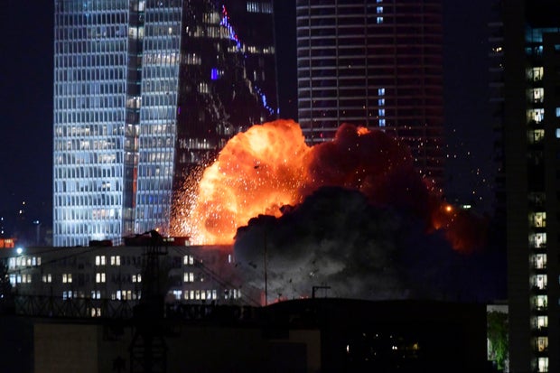 An explosion is seen during a missile attack in Tel Aviv
