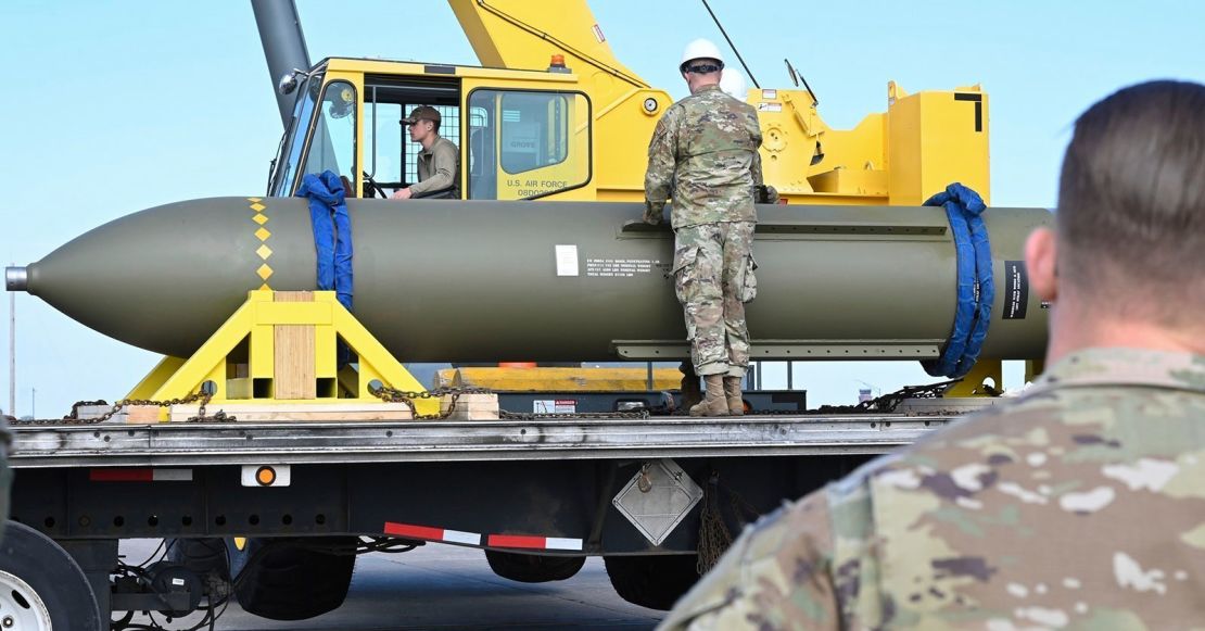 In this photo released by the US Air Force on May 2, 2023, airmen look at a GBU-57, known as the Massive Ordnance Penetrator, at Whiteman Air Base in Missouri.