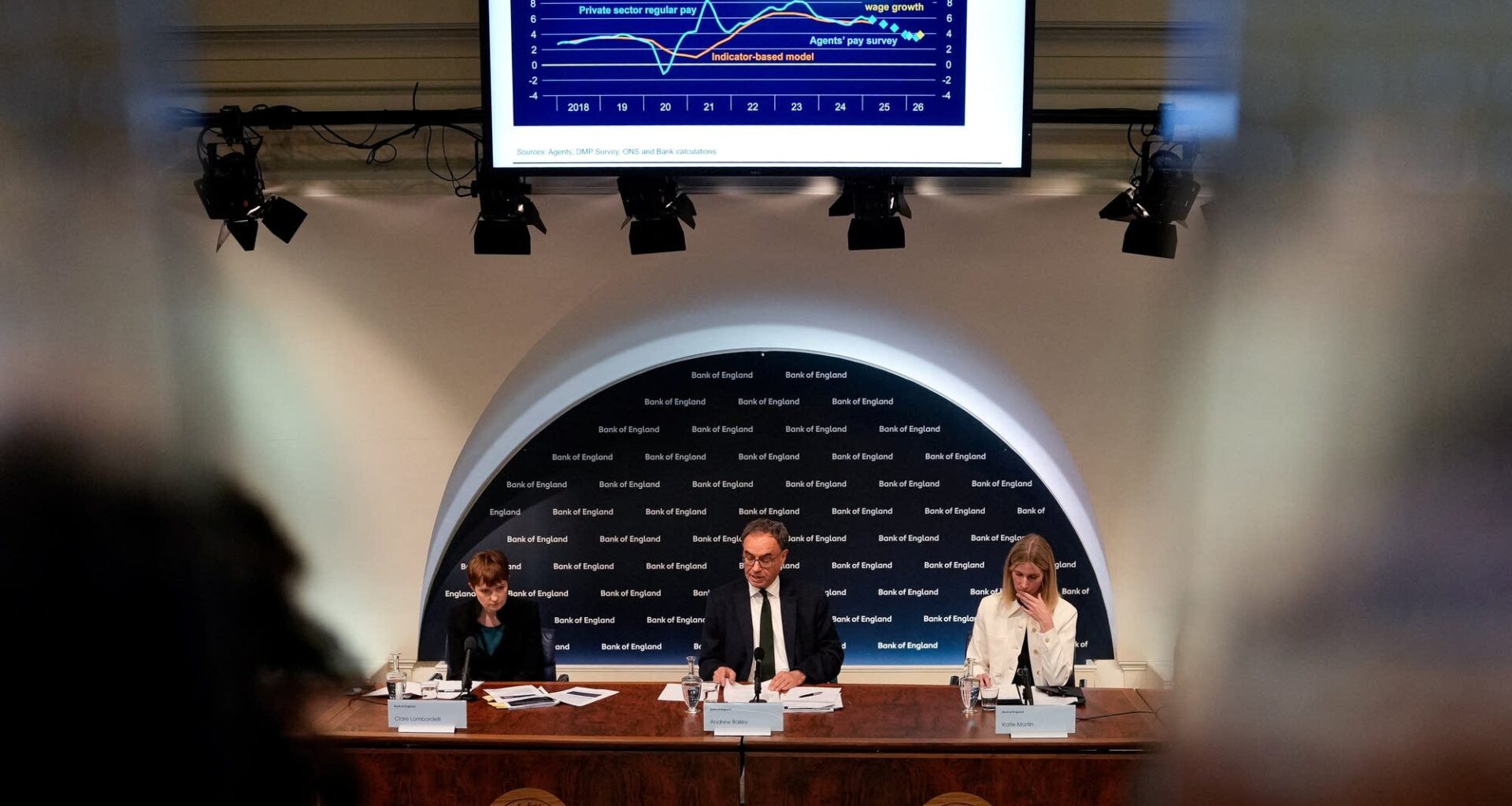 Bank of England officials speak during a press conference in May.