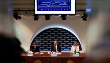 Bank of England officials speak during a press conference in May.