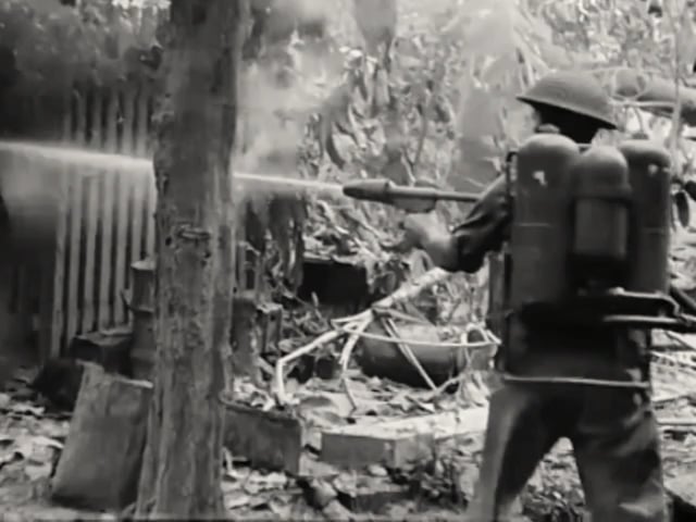US M2-2 flamethrower in Australian 9th Division service sets a Japanese solider ablaze during the Battle of Labuan in June 1945