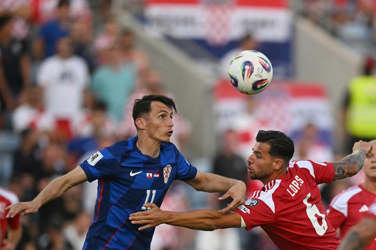 Croatia's forward #11 Ante Budimir and Gibraltar's defender #06 Bernardo Lopes vie for the ball during the 2026 World Cup Group L qualifier football match between Gibraltar and Croatia, at Algarve Stadium in Loule, Faro district, on June 6, 2025. (AFP Photo)