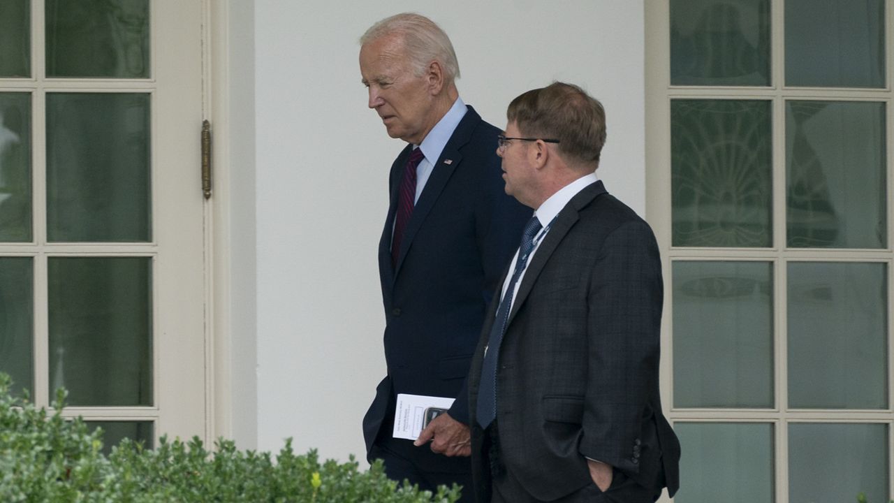 President Joe Biden walks along the Colonnade at the White House with his physician Kevin O'Connor, Monday, Aug. 28, 2023. (AP Photo/Manuel Balce Ceneta)