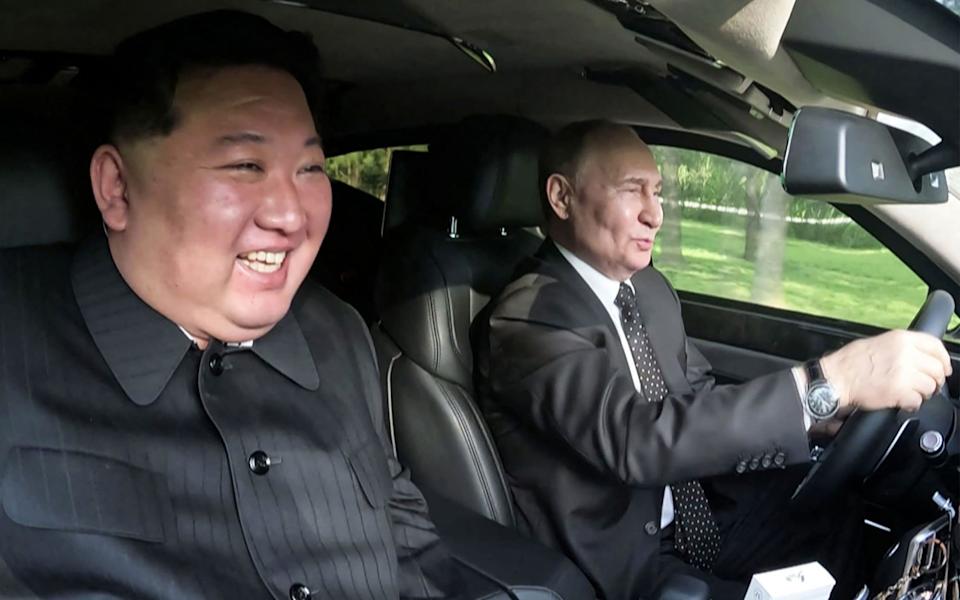 Kim Jong-un and Vladimir Putin in a car together in Pyongyang in 2024