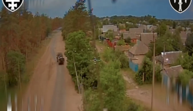 An FPV pilot of the Ukrainian "Signum" group flies his fiber-optic FPV quad through an open space in a Russian anti-drone net and hits a tank truck.