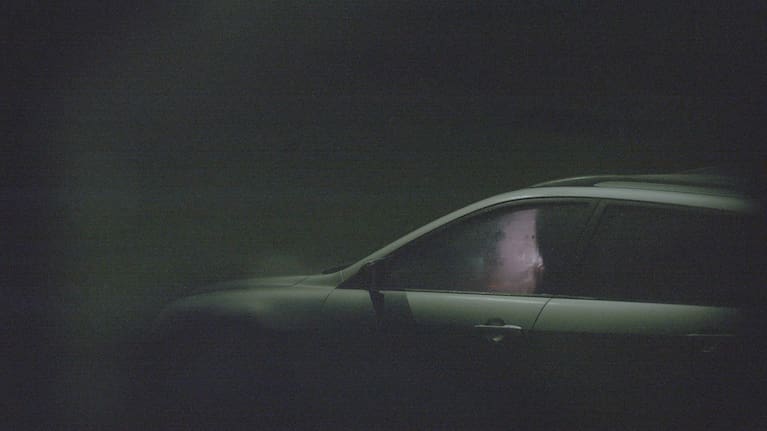 A car pulls up at a "hotspot".