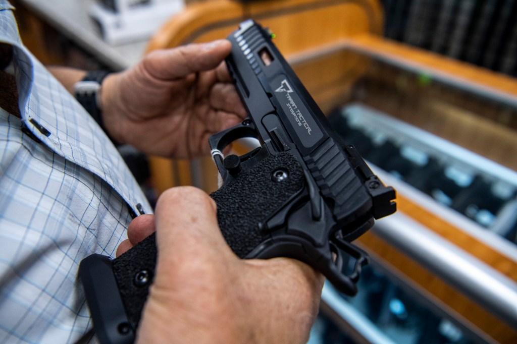 Person holding a handgun.