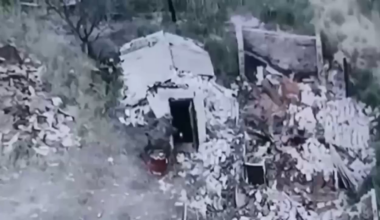 An Ukrainian soldier throws a TM-62 antitank mine into a basement used by russian forces.