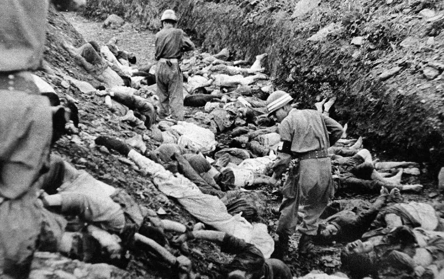 South Korean troops executed thousands of people in July 1950 near Deajeon, South Korea. US officers witnessed and photographed what became known as the Daejeon massacre.