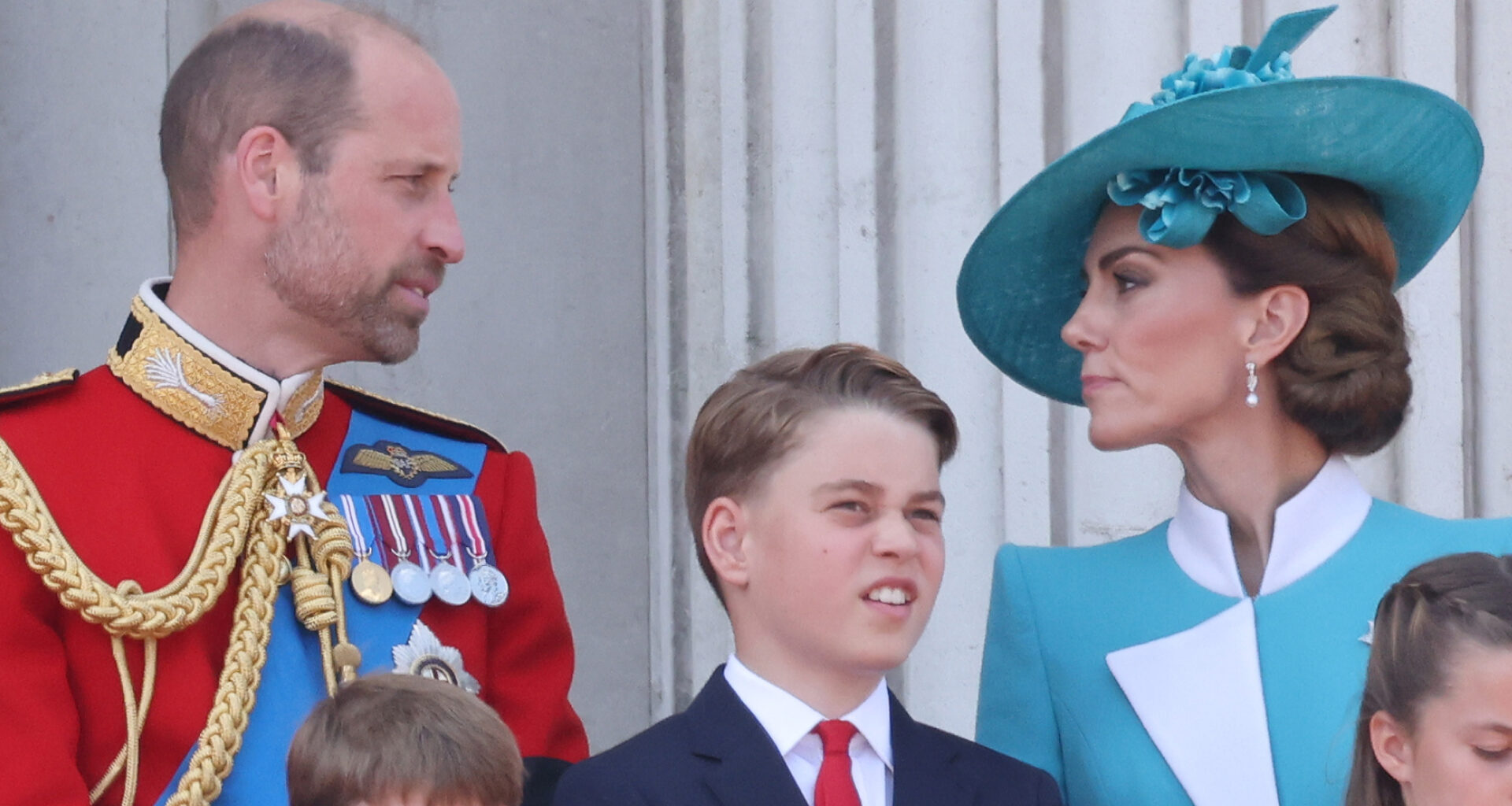 Kate Middleton and Prince William talking on the Buckingham Palace balcony at Trooping the Colour